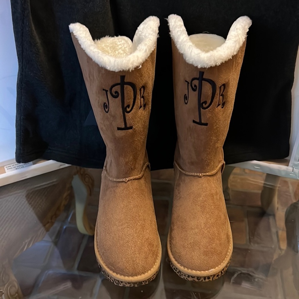 NWOT Women’s Brand new never worn monogrammed boots with leopard print soles.